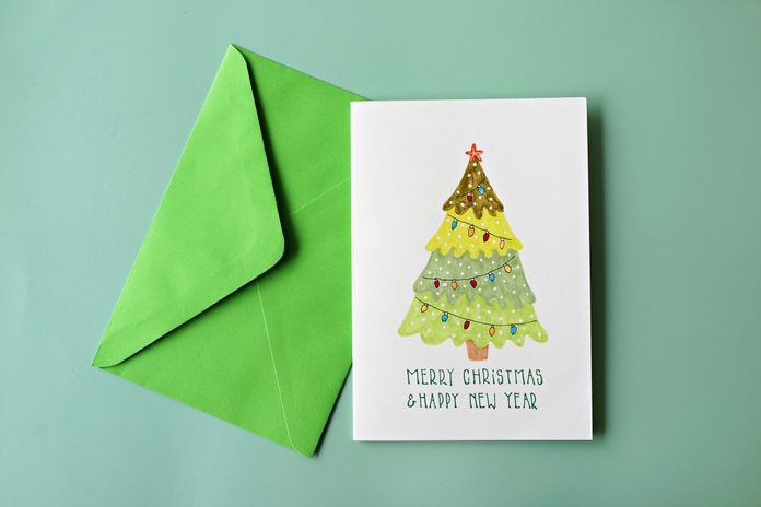 High Angle View Of Greeting Card On Green Background