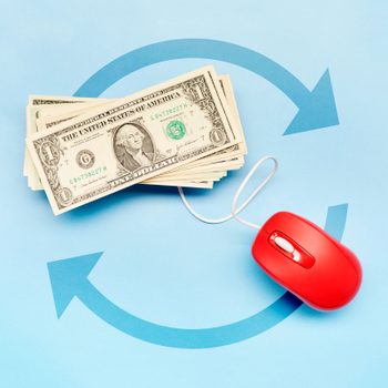 stack of dollar bills with a red computer mouse and a repeat symbol on a blue background