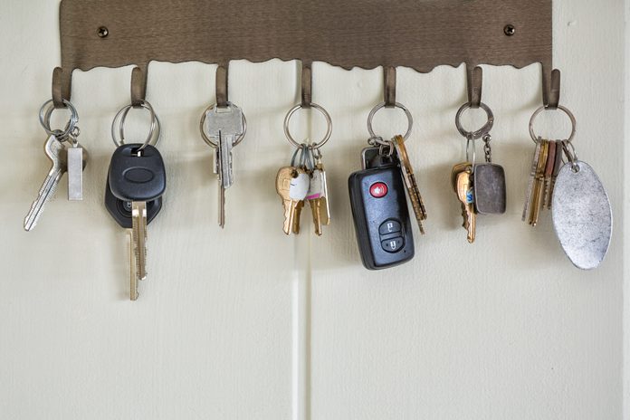 Several types of keys hanging on wall hooks