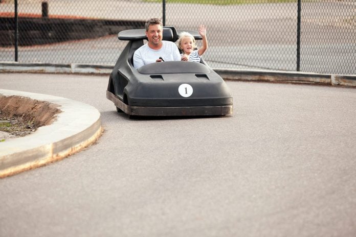 Father and Daughter Riding in Go Kart on Father's Day