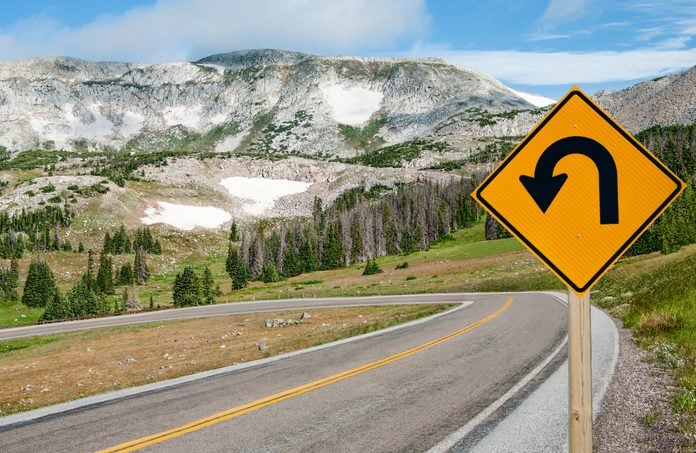 A sign warns motorists of a sharp bend ahead on the Snowy Range Scenic Byway in Wyoming.