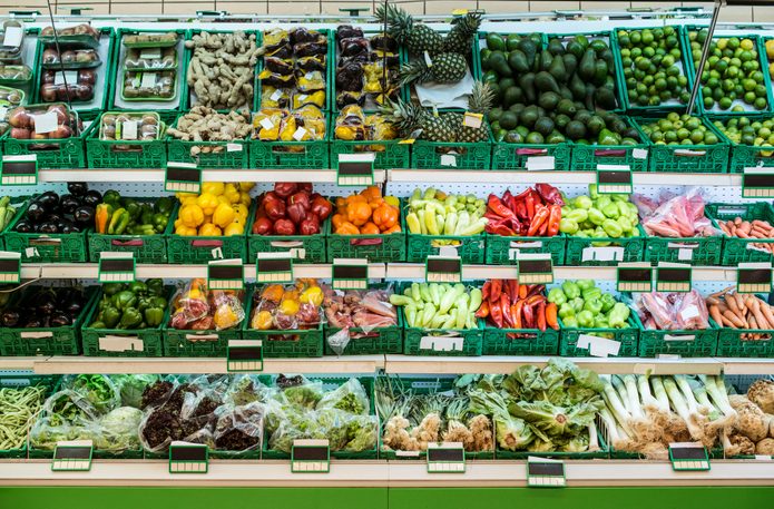 Stand with fruits and vegetables in the supermarket