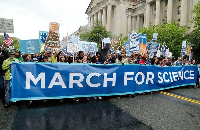 Marchers head down Constitution Avenue toward the U.S. Capital Building during the Earth Day March for Science on April 22, 2017 in Washington, DC.