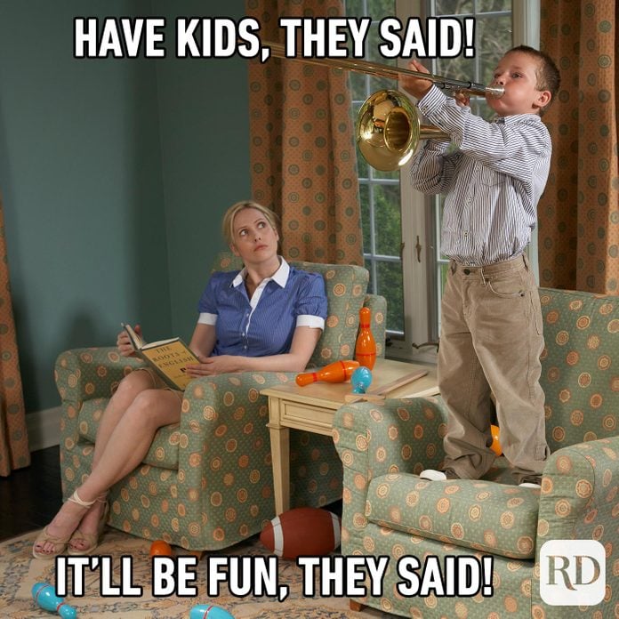 Child playing trumpet, standing on the couch, while mother watches. MEME TEXT: Have kids, they said! It'll be fun, they said!