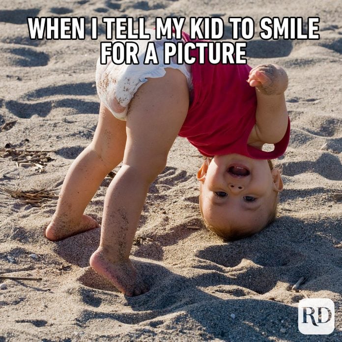 Child upside down laughing. MEME TEXT: When I tell my kid to smile for a picture