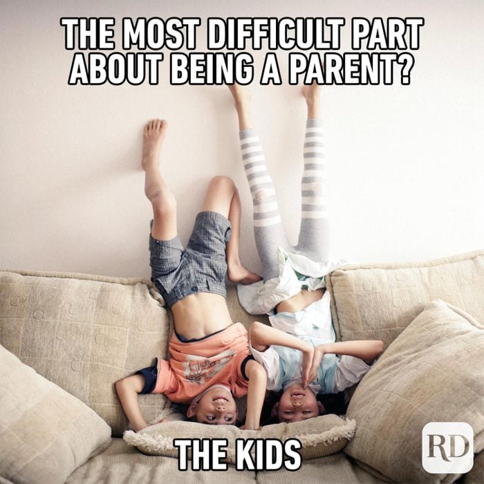 Two kids doing headstands on a couch MEME TEXT: The most difficult part about being a parent? The kids