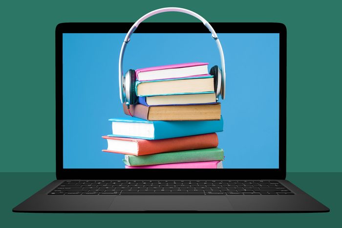 laptop with a stack of books with headphones around them popping off the screen; green background