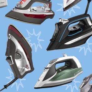 Collection of steam irons on a blue background