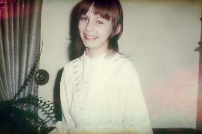 little girl smiling in vintage photo