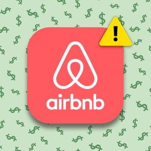Airbnb app logo with a warning symbol