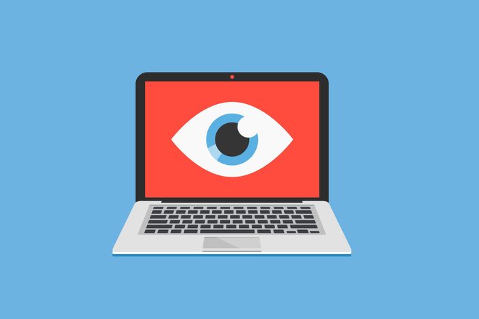 illustration of laptop with spy eye icon on the screen, blue background