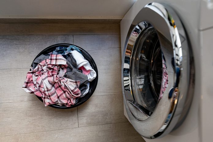 Laundry basket next to the washing machine