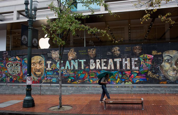 Black Lives Matter graffiti and murals cover many buildings downtown, including national chain stores such as Apple and Louis Vuitton, as seen on September 25, 2020 in Portland Oregon.
