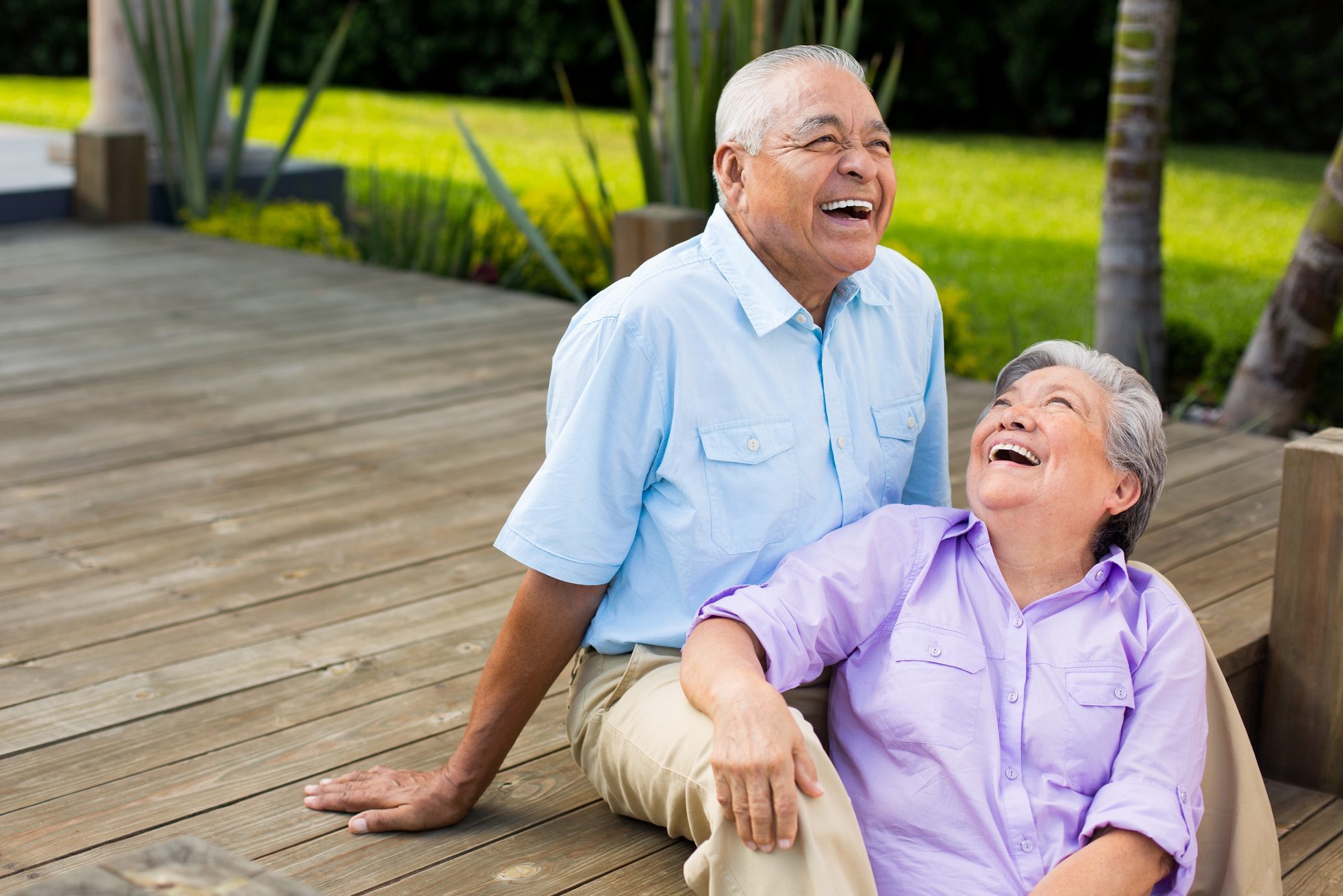 Latin couple laughing on deck