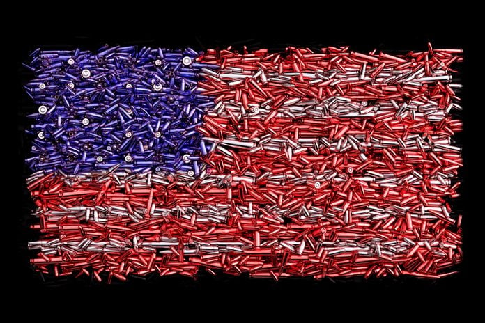 american flag made up of colored bullets; gun violence in america concept