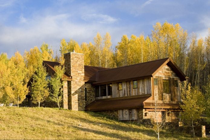 Private residence in Jackson Hole Wyoming. Home was photographed during peak fall foliage colors. The home features reclaimed barn wood on the exterior and interior, as well as corrugated metal roof top.
