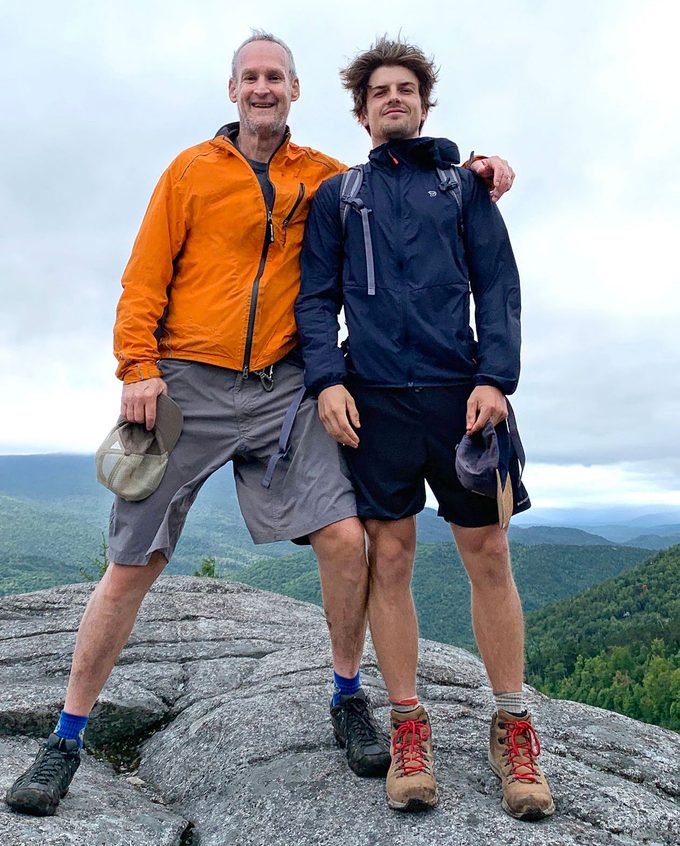Bruce Kelley and his son, Neil, pose for a photo on a hike