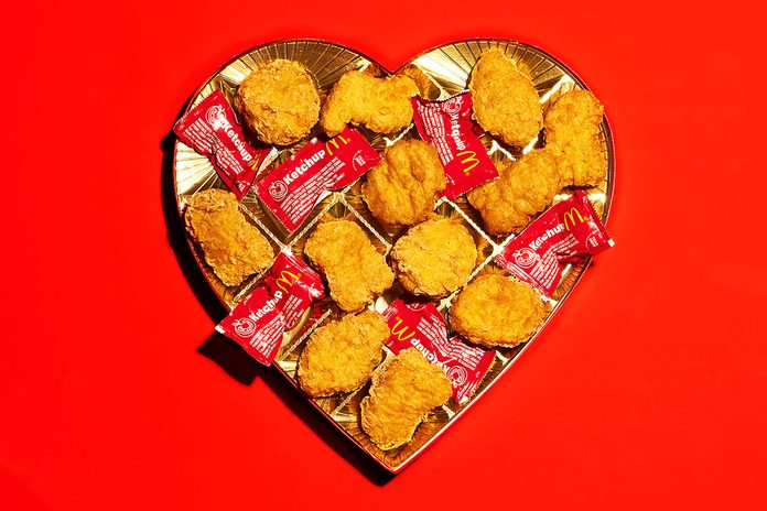 valentine candy box with mcdonalds chicken nuggets and ketchup packets where the chocolate would be