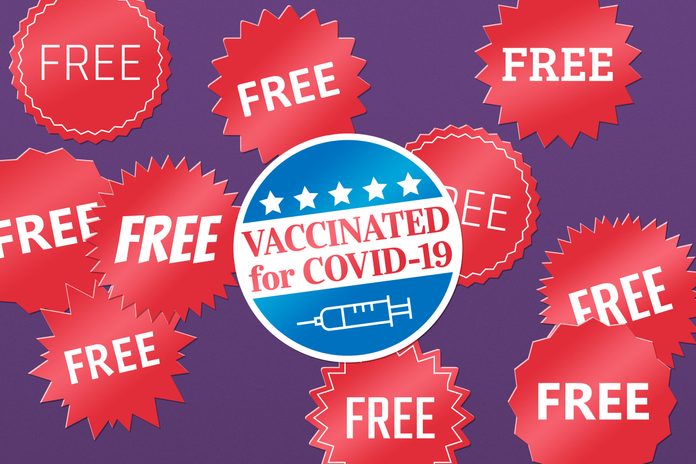 "free" stickers with a "vaccinated for covid-19" sticker in the center