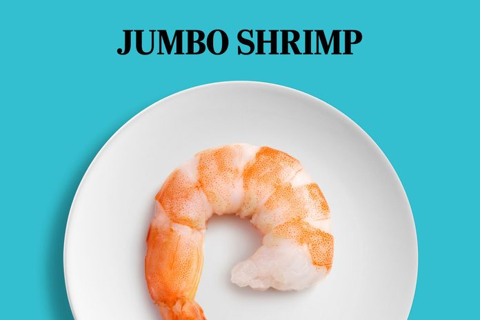 large shrimp that takes up most of the space on a white plate; text: Jumbo Shripm
