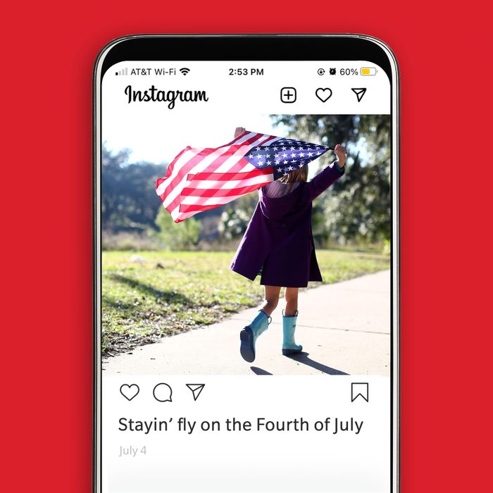 iPhone with Instagram app displaying photo of young girl flying American flag