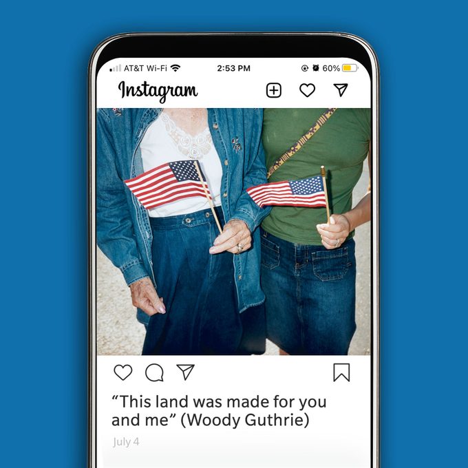 Instagram image of two people holding mini American flags