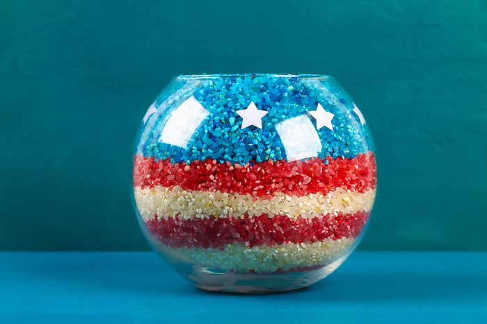 Diy 4th of July vase of glass jars and colored rice American flag, red, blue, white.