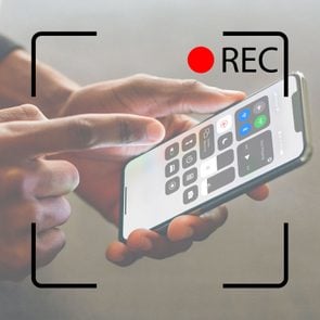 person using screen recording on an iphone with recording screen overlay