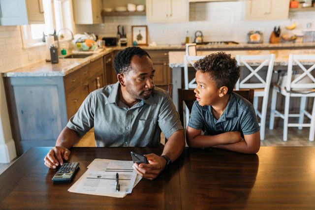 Father Teaching Son Home Finances