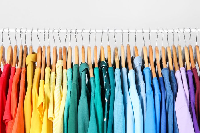 rack of clothes organized by color