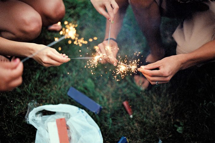 Hands holding consumer sparklers