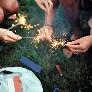 Hands holding consumer sparklers