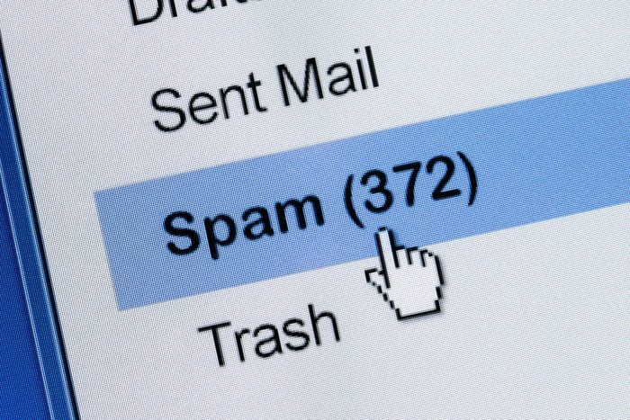 computer cursor clicking on email spam folder with 372 items
