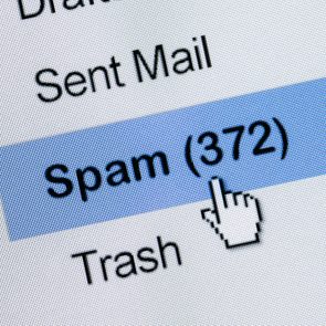 computer cursor clicking on email spam folder with 372 items