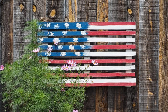 DIY American Flag made from wood on an exterior wood wall