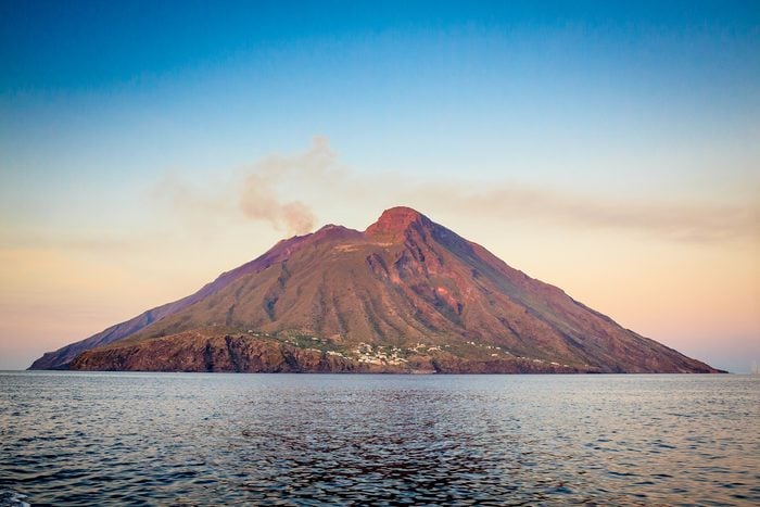 Scenic View Of Sea and Sromboli volcanic island During Sunset