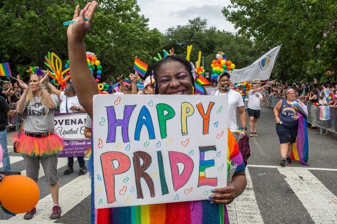 A woman holding a sign with Happy Pride written on it during the annual Pride Parade celebrations in Washington DC on june 11, 2022