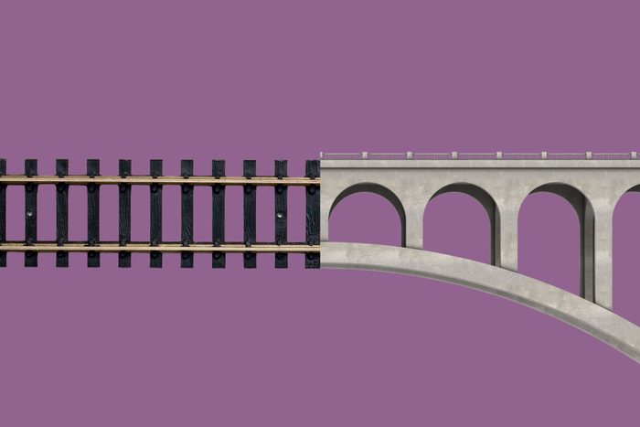 railroad tracks collaged with a bridge on purple background