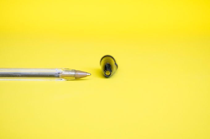 Hole in a bic pen cap with pen