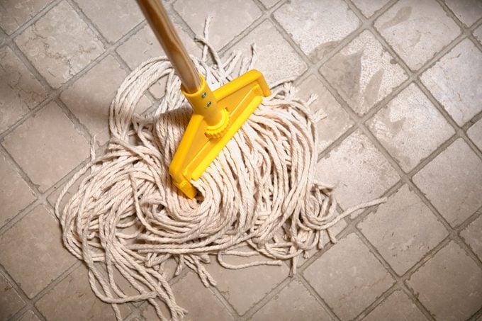 mop on tile floor from above