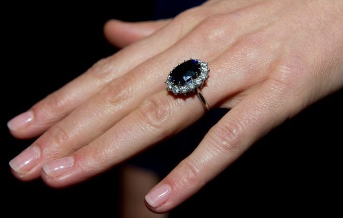 close up of princess diana's engagement ring on kate middleton's finger