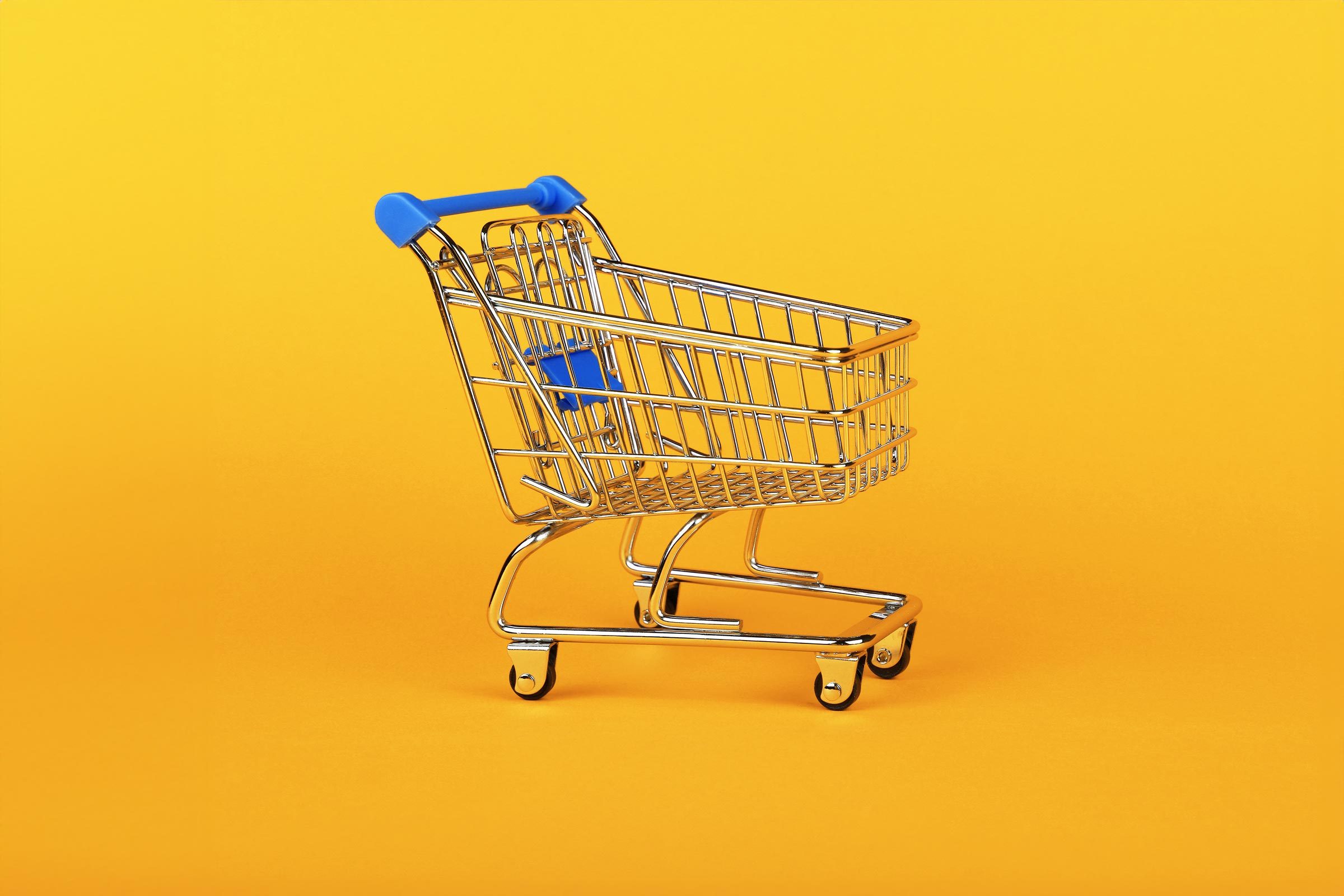 shopping cart on yellow background
