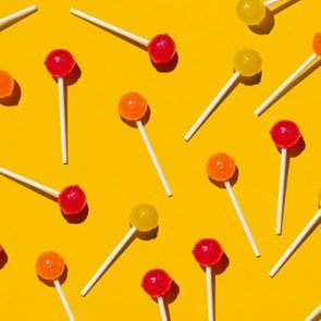 Pattern of lollipops against yellow background