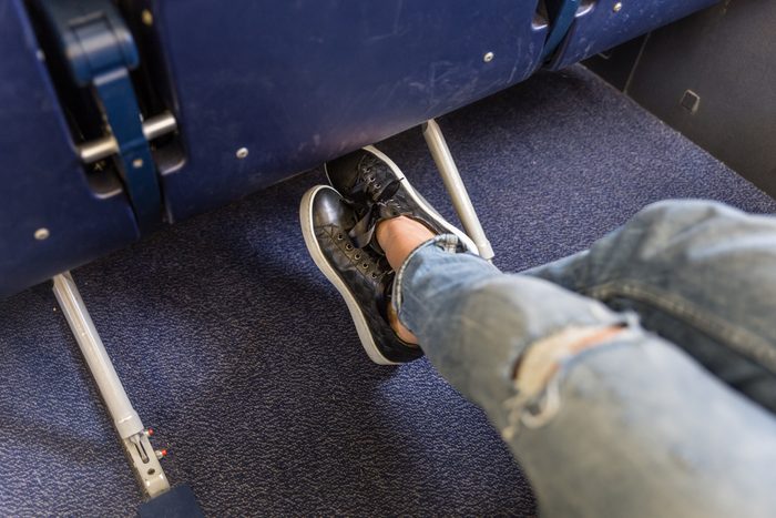 womans shoes on the floor of an airplane