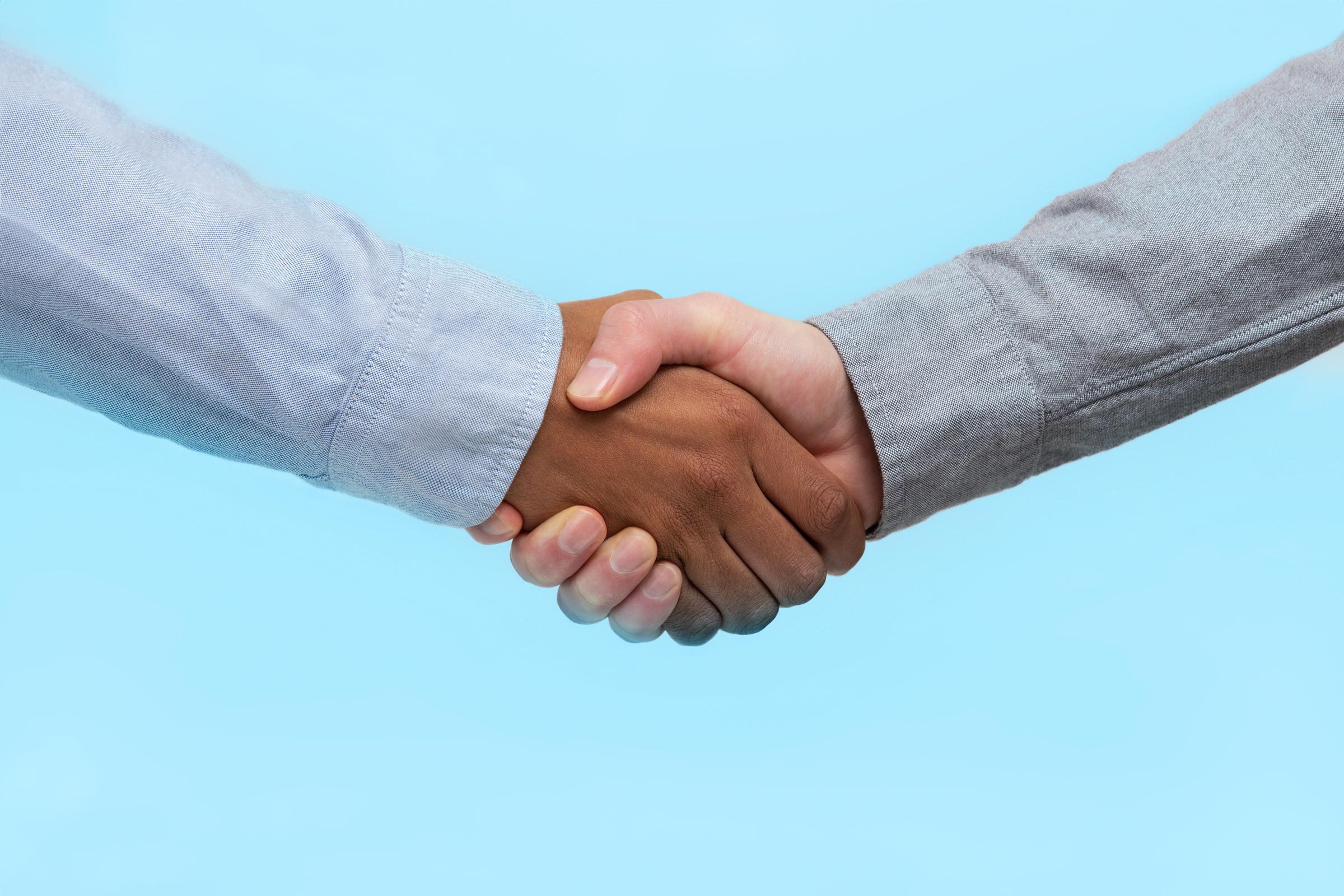 shaking hands on blue background
