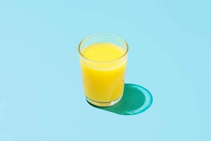 orange juice on blue background
