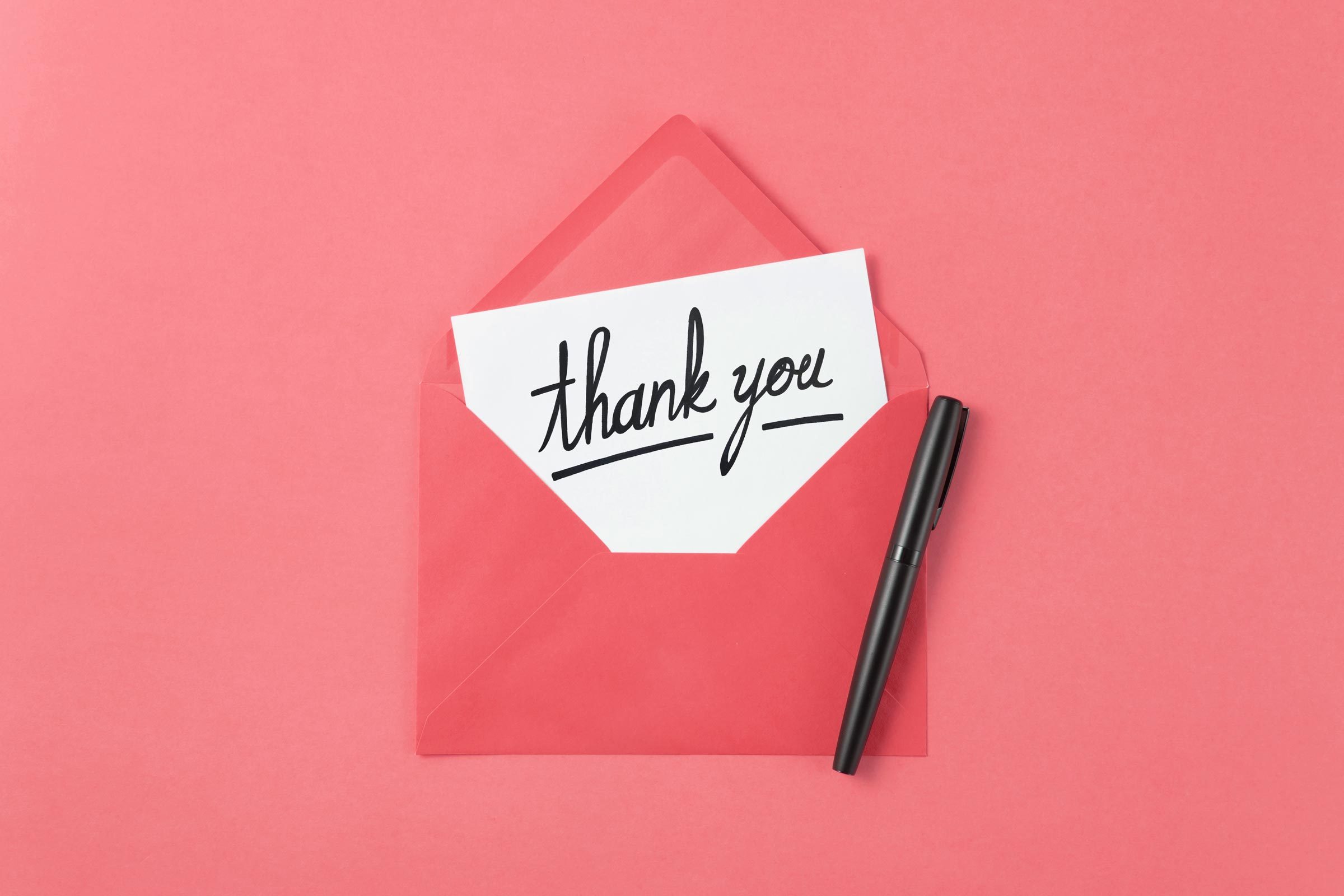 thank you note on a pink background