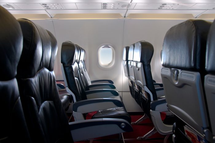 Premium Economy Class Seating Inside An Airplane Cabin