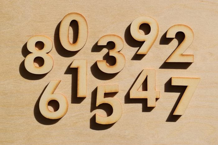 Wooden numbers on wood background