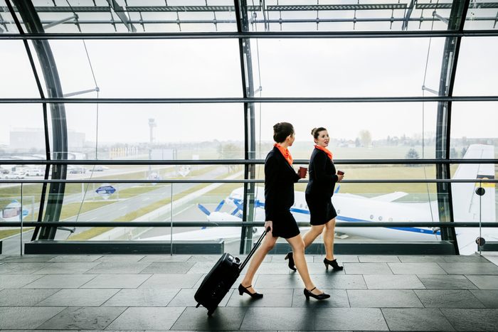 Two flight attendants on the way to their plane